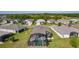 The screened-in pool in the backyard is the focal point of this home in a lovely neighborhood at 3641 Arlington Ridge Blvd, Leesburg, FL 34748