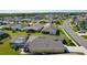 Aerial view of the house, highlighting the backyard screened-in pool and well-kept lawns at 3641 Arlington Ridge Blvd, Leesburg, FL 34748