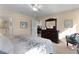 Bedroom with a dresser, soft carpet and light walls at 3641 Arlington Ridge Blvd, Leesburg, FL 34748