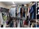 Walk-in closet with organized shelving and hanging storage for clothing and accessories at 3641 Arlington Ridge Blvd, Leesburg, FL 34748