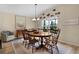 Cozy dining room features a wooden table and chairs, with natural light and stylish decor at 3641 Arlington Ridge Blvd, Leesburg, FL 34748