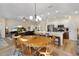 Open dining area with views of kitchen and living room, fostering a connected living space at 3641 Arlington Ridge Blvd, Leesburg, FL 34748