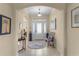 Welcoming foyer with neutral tones, tiled floor, arched entryway, and decorative accents at 3641 Arlington Ridge Blvd, Leesburg, FL 34748