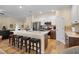 This kitchen features a spacious island with seating, stainless appliances, and ample storage at 3641 Arlington Ridge Blvd, Leesburg, FL 34748
