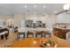 Well-lit kitchen with a large island, stainless steel appliances, and a view into other living spaces at 3641 Arlington Ridge Blvd, Leesburg, FL 34748