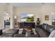Comfortable living room with a large TV, plush seating, and neutral decor, creating a cozy atmosphere at 3641 Arlington Ridge Blvd, Leesburg, FL 34748