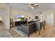 Inviting living room featuring a TV, comfortable seating, and bright ambiance, ideal for relaxation at 3641 Arlington Ridge Blvd, Leesburg, FL 34748