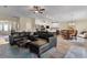 Bright and airy open-concept living space seamlessly connecting the living room, kitchen, and dining area at 3641 Arlington Ridge Blvd, Leesburg, FL 34748