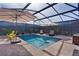 The screened-in pool features patio, lounge chairs, and patio umbrellas at 3641 Arlington Ridge Blvd, Leesburg, FL 34748