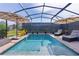 Screened-in pool featuring lounge chairs and umbrellas at 3641 Arlington Ridge Blvd, Leesburg, FL 34748