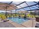 Beautiful pool with screened enclosure, sun umbrellas and loungers for relaxing in an outdoor oasis at 3641 Arlington Ridge Blvd, Leesburg, FL 34748