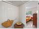 Bright bedroom features terrazzo flooring, closet and colorful decor through open doorway at 375 N Boyd St, Winter Garden, FL 34787