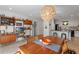 Open floor plan dining area with view to kitchen and modern shelving at 375 N Boyd St, Winter Garden, FL 34787