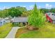 Charming home with a well-manicured front yard and cozy outdoor seating area at 375 N Boyd St, Winter Garden, FL 34787