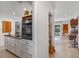 Hallway to kitchen and other living spaces is bright and well kept at 375 N Boyd St, Winter Garden, FL 34787