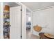 Hallway closet with unique storage with a basket and stick design and view to bedroom at 375 N Boyd St, Winter Garden, FL 34787