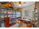 Organized storage room with shelves, clear bins, a work table, and window providing natural light at 375 N Boyd St, Winter Garden, FL 34787