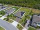 Aerial shot of a house with solar panels, showcasing its curb appeal within a community setting at 4131 Sunset Preserve Blvd, Orlando, FL 32820