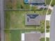 An overhead view captures the home's placement on a well-kept lot complete with solar panels and green grass at 4131 Sunset Preserve Blvd, Orlando, FL 32820