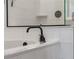 Modern bathtub with sleek matte black faucet and white tile surround offers a relaxing space at 4131 Sunset Preserve Blvd, Orlando, FL 32820