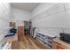 Walk-in closet with custom shelving, ample storage space, and hardwood floors for organization at 4131 Sunset Preserve Blvd, Orlando, FL 32820