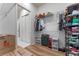 Walk-in closet with built-in shelving, hanging racks, and laminate wood flooring at 4131 Sunset Preserve Blvd, Orlando, FL 32820