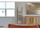 Bright living room with cozy blanket ladder and wooden cabinet with beach art above at 4131 Sunset Preserve Blvd, Orlando, FL 32820