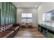 Cozy living room showcasing a tufted sofa, study space, and a mounted television at 4131 Sunset Preserve Blvd, Orlando, FL 32820