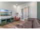 Cozy living room with modern furnishings, entertainment center, and lots of natural light at 4131 Sunset Preserve Blvd, Orlando, FL 32820