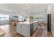 Open concept with kitchen island, dining area, and living room with ample natural light at 4131 Sunset Preserve Blvd, Orlando, FL 32820