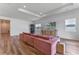 Living room featuring vinyl floors, recessed lighting, and large windows at 4131 Sunset Preserve Blvd, Orlando, FL 32820