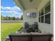 Relaxing outdoor patio with a fire pit, comfortable seating, and a view of the backyard at 4131 Sunset Preserve Blvd, Orlando, FL 32820