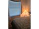 Cozy bedroom featuring a comfortable bed with floral bedding and natural light streaming through the window at 5008 Sawgrass Lake Cir, Leesburg, FL 34748