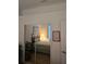Bedroom featuring floral bedding, mirrored closet doors, and a cozy atmosphere with soft lighting and decor at 5008 Sawgrass Lake Cir, Leesburg, FL 34748
