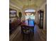 Formal dining room with hardwood floors, large window, and elegant furnishings at 5008 Sawgrass Lake Cir, Leesburg, FL 34748