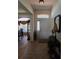 Inviting foyer with tiled floors, views of the formal dining room, and elegant decorative touches at 5008 Sawgrass Lake Cir, Leesburg, FL 34748