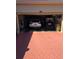 View of garage with car and golf cart inside; red brick ground at 5008 Sawgrass Lake Cir, Leesburg, FL 34748