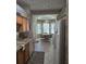 Bright eat-in kitchen boasts a bay window, tile floors, light cabinets, and stainless steel appliances at 5008 Sawgrass Lake Cir, Leesburg, FL 34748