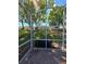 Inviting screened patio offers serene views of the lush backyard, complete with mature trees and landscaping at 5008 Sawgrass Lake Cir, Leesburg, FL 34748