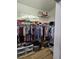 Well-organized walk-in closet with ample shelving and hanging space at 5008 Sawgrass Lake Cir, Leesburg, FL 34748