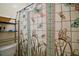 Bathroom with decorative butterfly shower curtain and wall shelving for convenient storage at 5331 Magnolia Ridge Rd, Fruitland Park, FL 34731