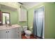 Cozy bathroom with a combination shower and tub and a modern vanity at 5331 Magnolia Ridge Rd, Fruitland Park, FL 34731