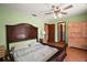 This bedroom offers a comfortable bed and closet space, with a neutral color palette at 5331 Magnolia Ridge Rd, Fruitland Park, FL 34731