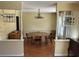 The dining room has a decorative chandelier and wood floors, perfect for hosting at 5331 Magnolia Ridge Rd, Fruitland Park, FL 34731