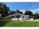 Exterior view of a well-maintained house with lush landscaping, offering great curb appeal at 5331 Magnolia Ridge Rd, Fruitland Park, FL 34731