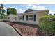 Side exterior of a home featuring well-maintained landscaping at 5331 Magnolia Ridge Rd, Fruitland Park, FL 34731