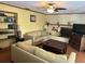 Comfortable living room features a decorative brick fireplace and built-in shelving for storage at 5331 Magnolia Ridge Rd, Fruitland Park, FL 34731