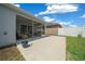 Screened patio with comfortable seating offering views of the backyard and privacy fence at 5549 Millican Ave, The Villages, FL 32163