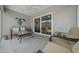 Screened patio with comfortable seating, a ceiling fan, and a view into the living room at 5549 Millican Ave, The Villages, FL 32163