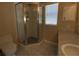 Bathroom with a corner glass shower, neutral colored walls, and tiled flooring, with a window at 664 San Pedro Dr, The Villages, FL 32159